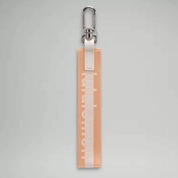 Lululemon - Never Lost Keychain *Wordmark - Peach Bellini - NWoT - Picture 1 of 4
